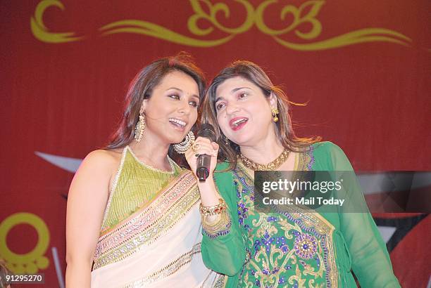 Bollywood actress Rani Mukherjee and singer Alka Yagnik sing during a cultural programme on the occasion of "Navratri" festival in Mumbai on Friday,...