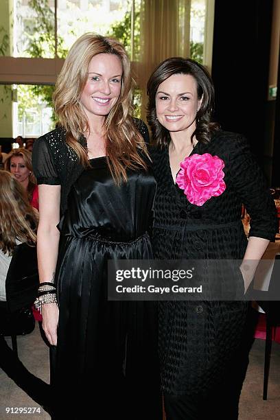 Model and TV Personality Charlotte Dawson and TV Host Lisa Wilkinson pose during the McGrath Foundation High Tea at the Ivy on October 1, 2009 in...