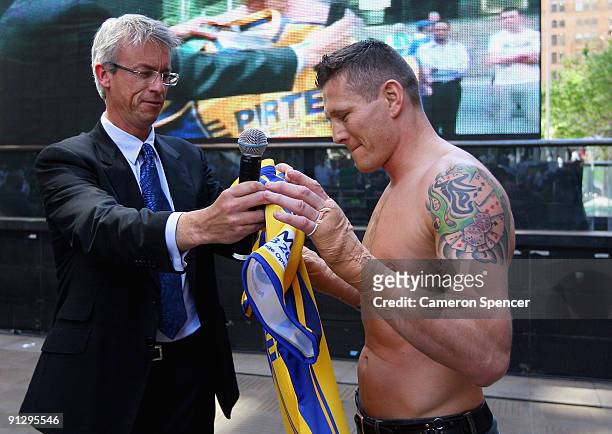 Boxer Danny Green is presented a Parramatta Eels jersey by NRL CEO David Gallop during a Danny Green Media Opportunity at Martin Place on October 1,...