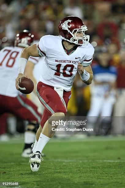 Quarterback Jeff Tuel of the Washington State Cougars carries the ball against the USC Trojans on September 23, 2009 at the Los Angeles Coliseum in...