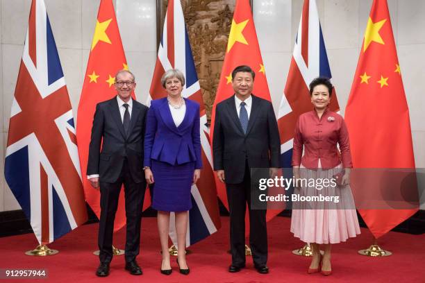From left to right, Philip May, husband of U.K. Prime Minister Theresa May, Theresa May, U.K. Prime minister, Xi Jinping, China's president, and Peng...