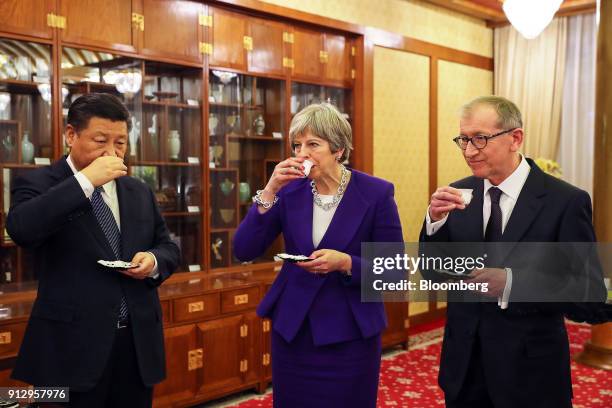 From left to right, Xi Jinping, China's president, Theresa May, U.K. Prime minister, Philip May, husband of U.K. Prime Minister Theresa May, drink...