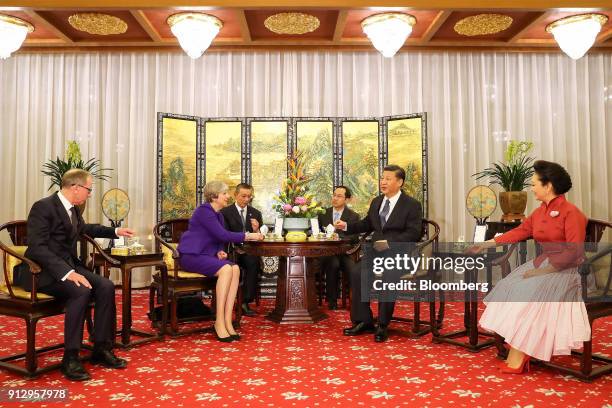 From left to right, Philip May, husband of U.K. Prime Minister Theresa May, Theresa May, U.K. Prime minister, Xi Jinping, China's president, and Peng...