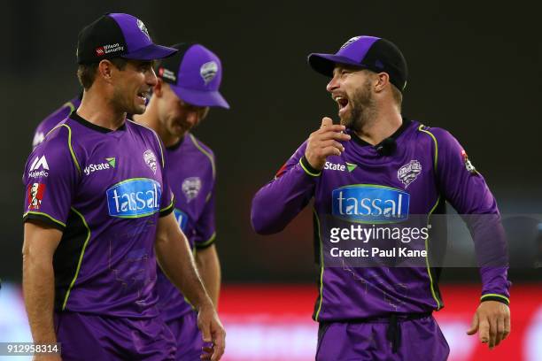 Matthew Wade of the Hurricanes shares a moment with Nathan Reardon after winning the Big Bash League Semi Final match between the Perth Scorchers and...