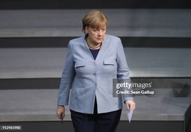 German Chancellor Angela Merkel attends debates at the Bundestag over a proposal concerning the rights of refugees who have been granted limited...