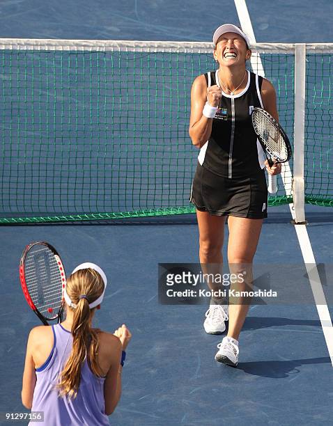 Ai Sugiyama of Japan and Daniela Hantuchova of Slovakia celebrate after their women's doubles quarter-final match against Anabel Medina Garrigues of...