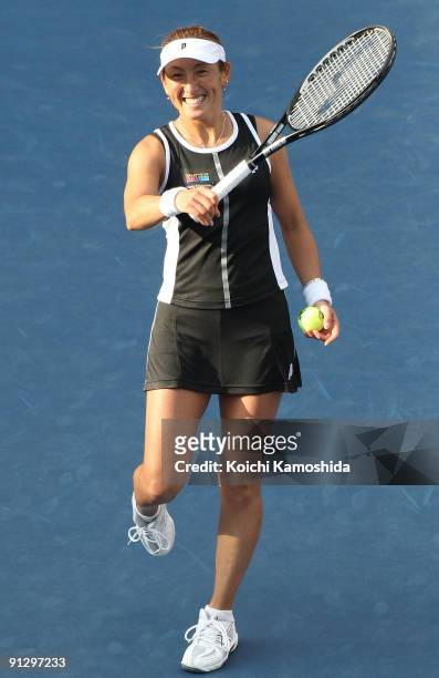 Ai Sugiyama of Japan smiles following her doubles match with Daniela Hantuchova of Slovakia after winning their women's doubles quarter-final match...