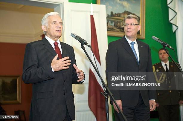 President of European Parliament Jerzy Buzek gestures as he answers questions during a press conference with President of Latvia Valdis Zatlers on...
