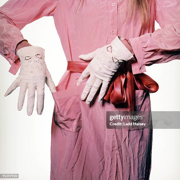 gloved woman checks pockets - pocket square fotografías e imágenes de stock