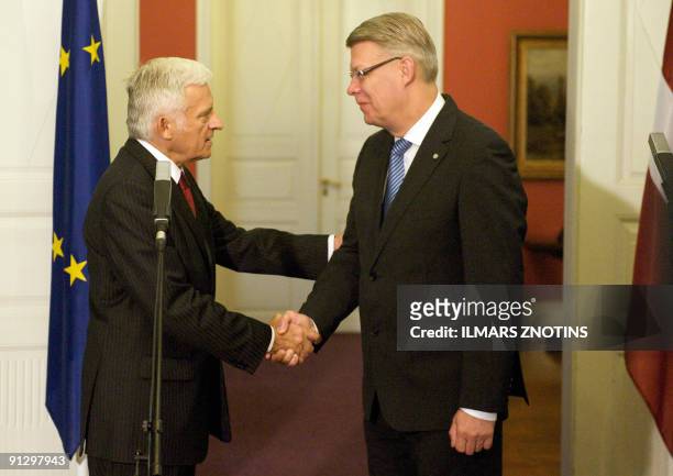 President of European Parliament Jerzy Buzek gestures shakes hands with President of Latvia Valdis Zatlers during a press conference on October 1 in...