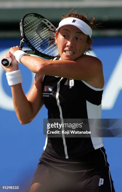 Ai Sugiyama of Japan in action in the women's doubles quarter-final match with her partner Daniela Hantuchova of Slovakia against Anabel Medina...