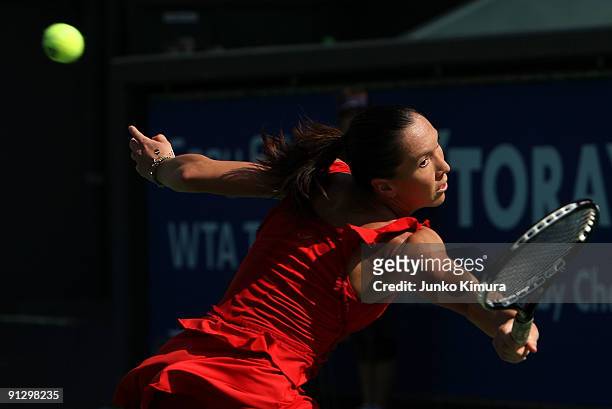 Jelena Jankovic of Serbia returns a shot against Marion Bartoli of France during day five of the Toray Pan Pacific Open Tennis tournament at Ariake...