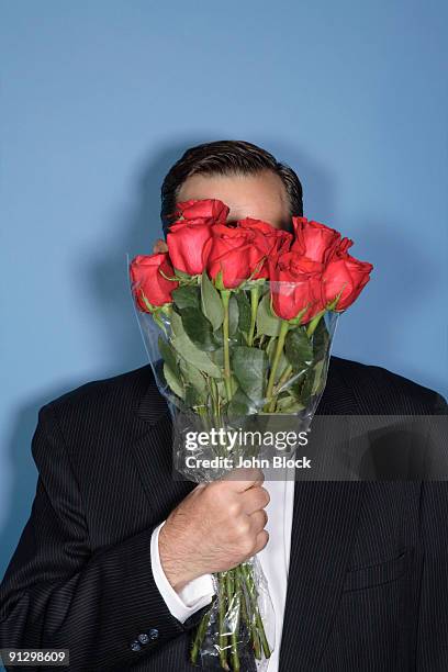 Man Among Roses Man And Suit And Hold Rose Photos and Premium High Res Pictures - Getty ...