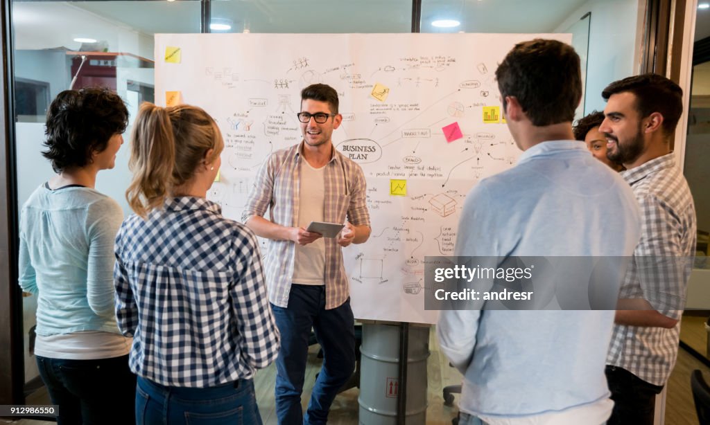 Man talking in a business meeting at a creative office