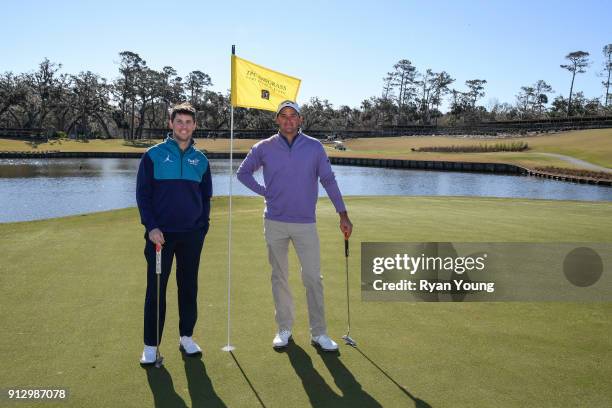 Driver Denny Hamlin and PGA TOUR golfer Sam Saunders on the 17th hole at THE PLAYERS Stadium Course at TPC Sawgrass on January 31, 2018 in Ponte...