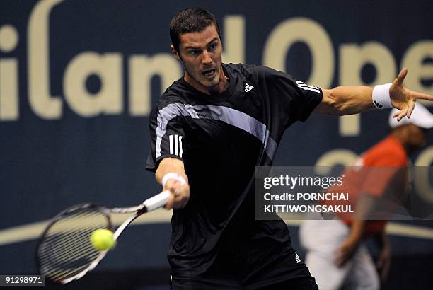 Marat Safin of Russia returns to Swiss player Macro Chiudinelli during their second round ATP Thailand Open tennis match in Bangkok on October 1,...