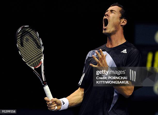 Marat Safin of Russia reacts to a point during his second round of ATP Thailand Open tennis match Swiss player Macro Chiudinelli in Bangkok on...