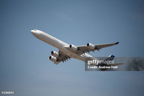 airbus a340-600 aircraft flying - farnborough stock pictures, royalty-free photos & images