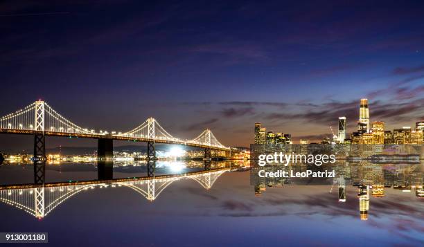 modern futuristic downtown san francisco skyline at night - golden gate bridge night stock pictures, royalty-free photos & images