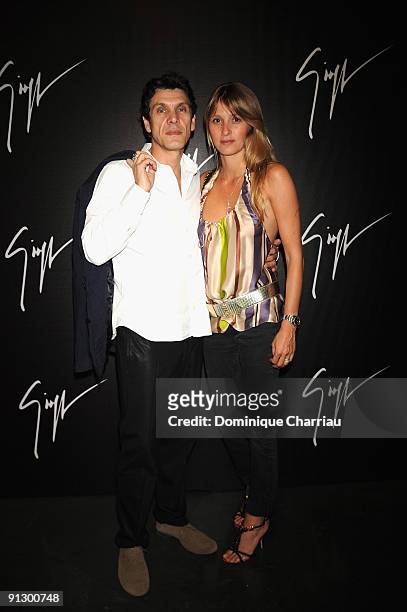 French actor Marc Lavoine and his wife Sarah attend the Giuseppe Zanotti Design Paris party at the Mini Palais July 1, 2008 in Paris, France.