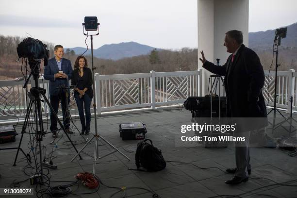 Rep. Mark Meadows, R-N.C., right, talks with Rep. Sean Duffy, R-Wis., and his wife Rachel Campos-Duffy at the media center during House and Senate...