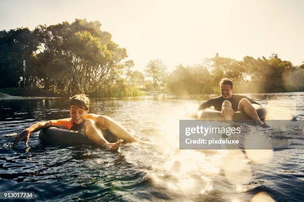 solchen spaß heute - schwimmring stock-fotos und bilder