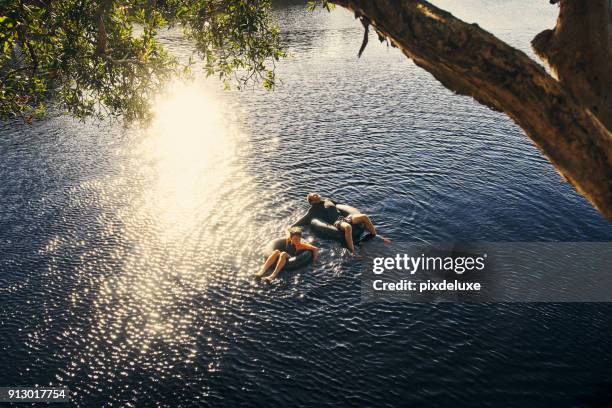 enjoying the little things with my son - river tubing stock pictures, royalty-free photos & images