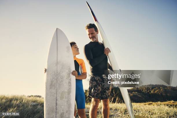 catching up and catching some waves - surfing australia stock pictures, royalty-free photos & images