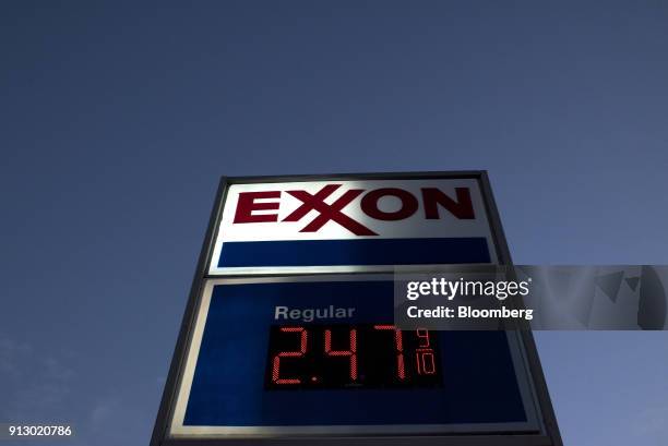 Sign displays fuel prices at an Exxon Mobil Corp. Gas station in Nashport, Ohio, U.S., on Friday, Jan. 26, 2018. Exxon Mobil Corp. Is scheduled to...