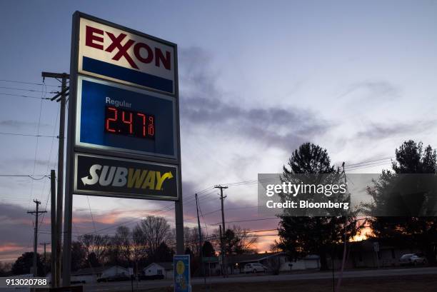 Sign displays fuel prices at an Exxon Mobil Corp. Gas station in Nashport, Ohio, U.S., on Friday, Jan. 26, 2018. Exxon Mobil Corp. Is scheduled to...