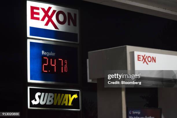 Sign displays fuel prices at an Exxon Mobil Corp. Gas station in Nashport, Ohio, U.S., on Friday, Jan. 26, 2018. Exxon Mobil Corp. Is scheduled to...