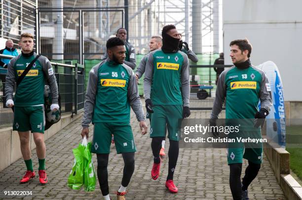 Mandela Egbo, Reece Oxford and Lars Stindl enter the pitch during a training session of Borussia Moenchengladbach at Borussia-Park on February 01,...