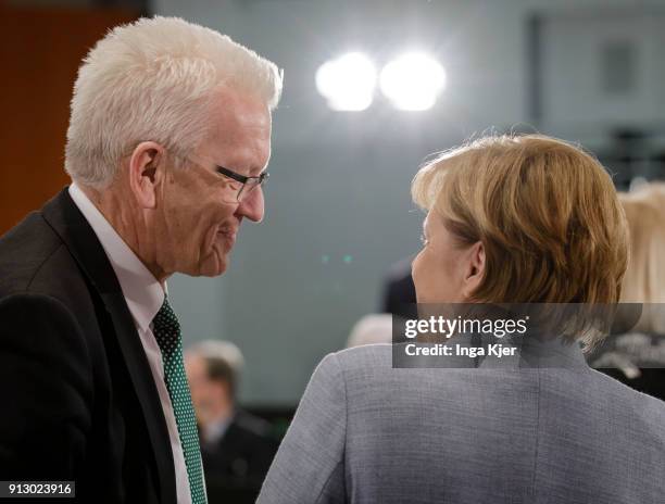 German Chancellor Angela Merkel and Winfried Kretschmann, Minister President of the state of Baden-Wuerttemberg, attend a meeting with regional state...