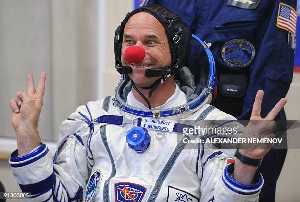 Canadian space tourist and founder of Cirque du Soleil Guy Laliberte jokes during space suit testing prior to his blast off from a Russian leased...