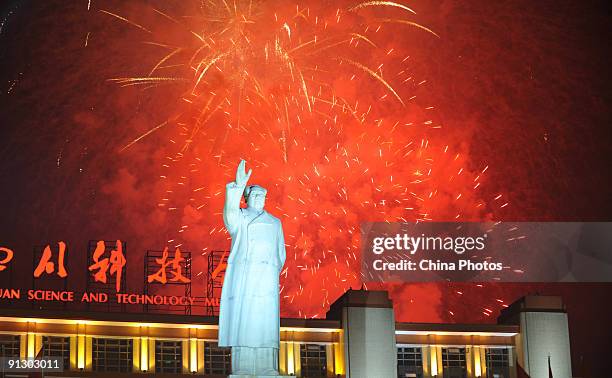 Fireworks explode over the statue of former Chinese leader Mao Zedong at the Tianfu Square on October 1, 2009 in Chengdu of Sichuan Province, China....