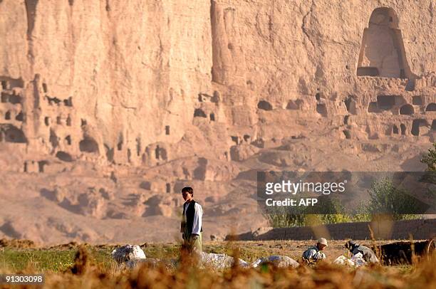 Afghanistan-unrest-NZealand-military-development,FOCUS by Lynne O'Donnell This photograph taken on September 25 a Hazara youth works on a farm in...
