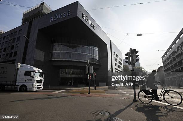 Woman rides a bike by the building housing the Zurich Stock Exchange on October 1, 2009. Switzerland is a financial global crossroad. The Swiss...