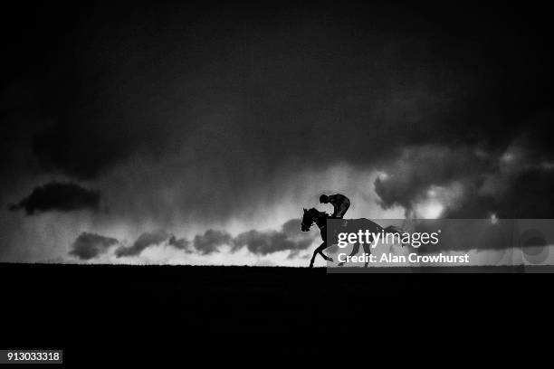 Runner arrives at the start as rain clouds loom in the distance at Wincanton racecourse on February 1, 2018 in Wincanton, England.