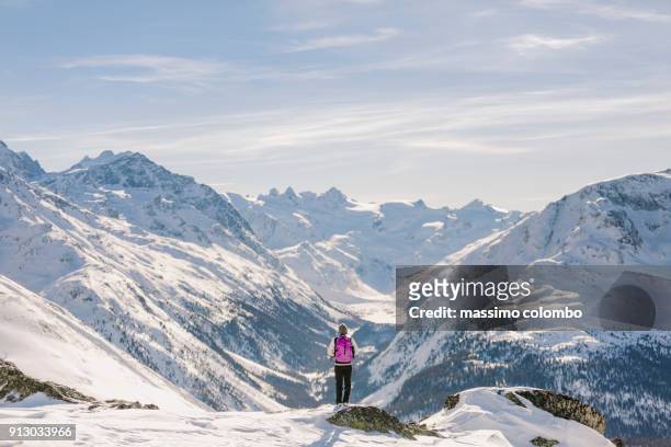 solo hiker woman admire the alpine landscape - saint moritz stock-fotos und bilder