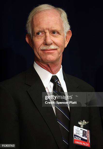 Airway pilot Chesley "Sully" Sullenberger attends a news conference at LaGuardia Airport on his first official day back in the cockpit on October 1,...