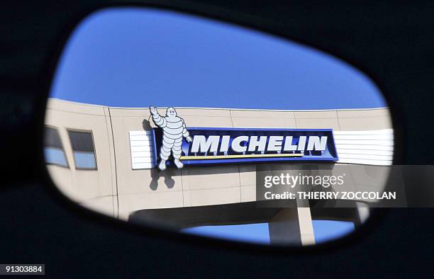 View taken on June 17 through a rear-view mirror shows the logo of French tyre maker Michelin in Clermont-Ferrand, after Michelin said Today it would...