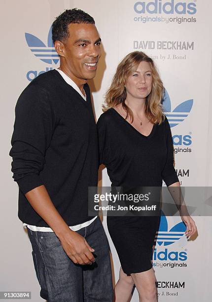 Actress Ellen Pompeo and husband Chris Ivery pose at the David Beckham And James Bond Adidas Originals on September 30, 2009 in Los Angeles,...