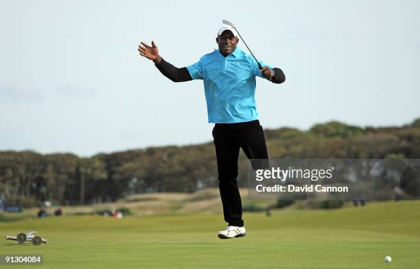 Manuel De Los Santos of the Dominican Republic leaps as he just misses a birdie putt at the 9th hole during the first round of the Alfred Dunhill...