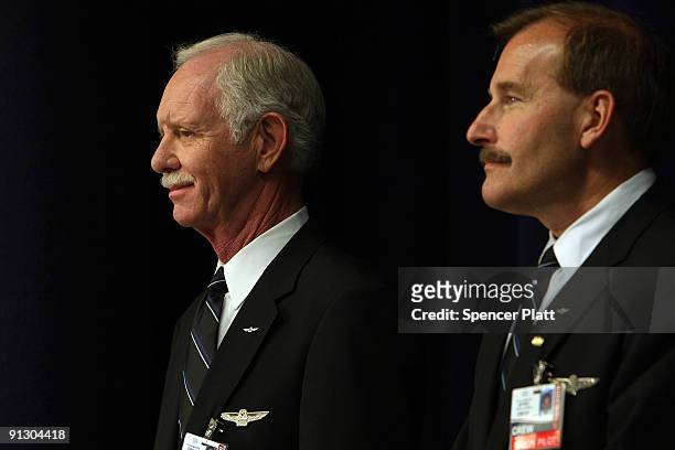 Airway pilot Chesley "Sully" Sullenberger and co-pilot Jeffrey Skiles attend a news conference at LaGuardia Airport on Sullenberger's first official...