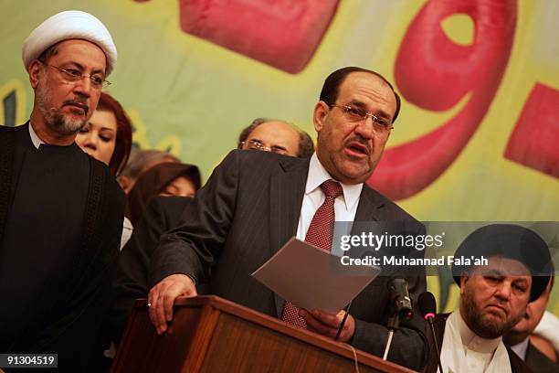 Iraqi Prime Minister Nuri al-Maliki reads a speech during a meeting for his "State of Law Coalition", a political alliance for the upcoming Iraqi...