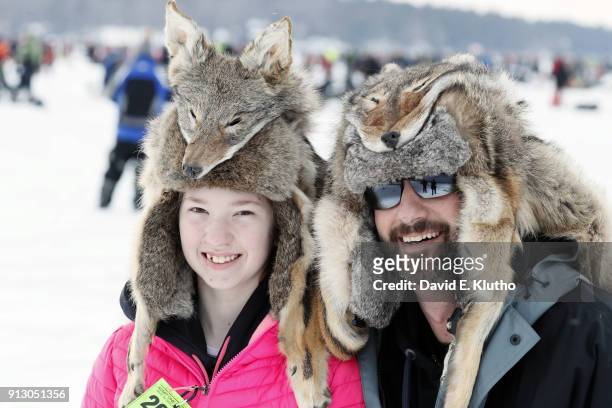 Brainerd Jaycees Ice Fishing Extravaganza: View of contestants Peter and Dakota wearing coyote hats during event on Brainerd Lakes. Contestants came...