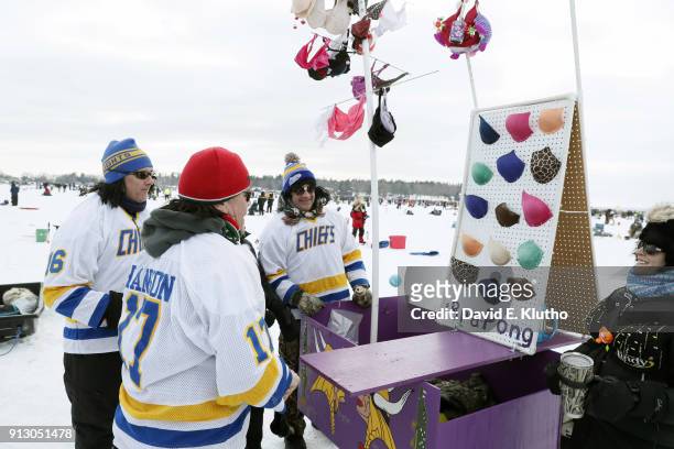 Brainerd Jaycees Ice Fishing Extravaganza: Participants playing "Bra Pong" to raise money for breast cancer awareness during event at Brainerd Lakes....