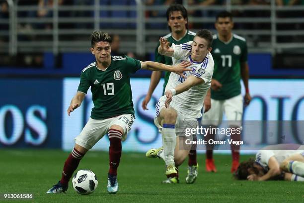 Jonathan Gonzalez of Mexico fights for the ball with Dino Besirovic of Bosnia and Herzegovina during the friendly match between Mexico and Bosnia and...