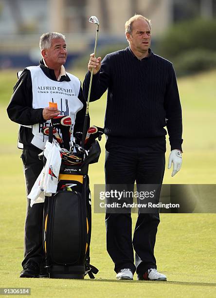 Sir Steve Redgrave, former English rowing great, waits with his caddie on the second hole during the first round of The Alfred Dunhill Links...