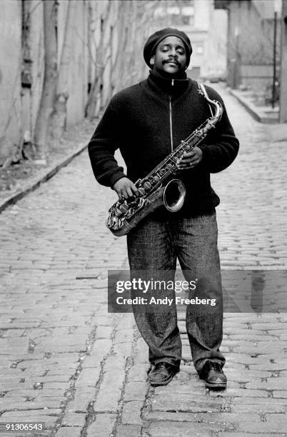 Portrait of jazz musician David Murray standing on a cobblestone street in Greenwich Village, NY, ca.1980s.